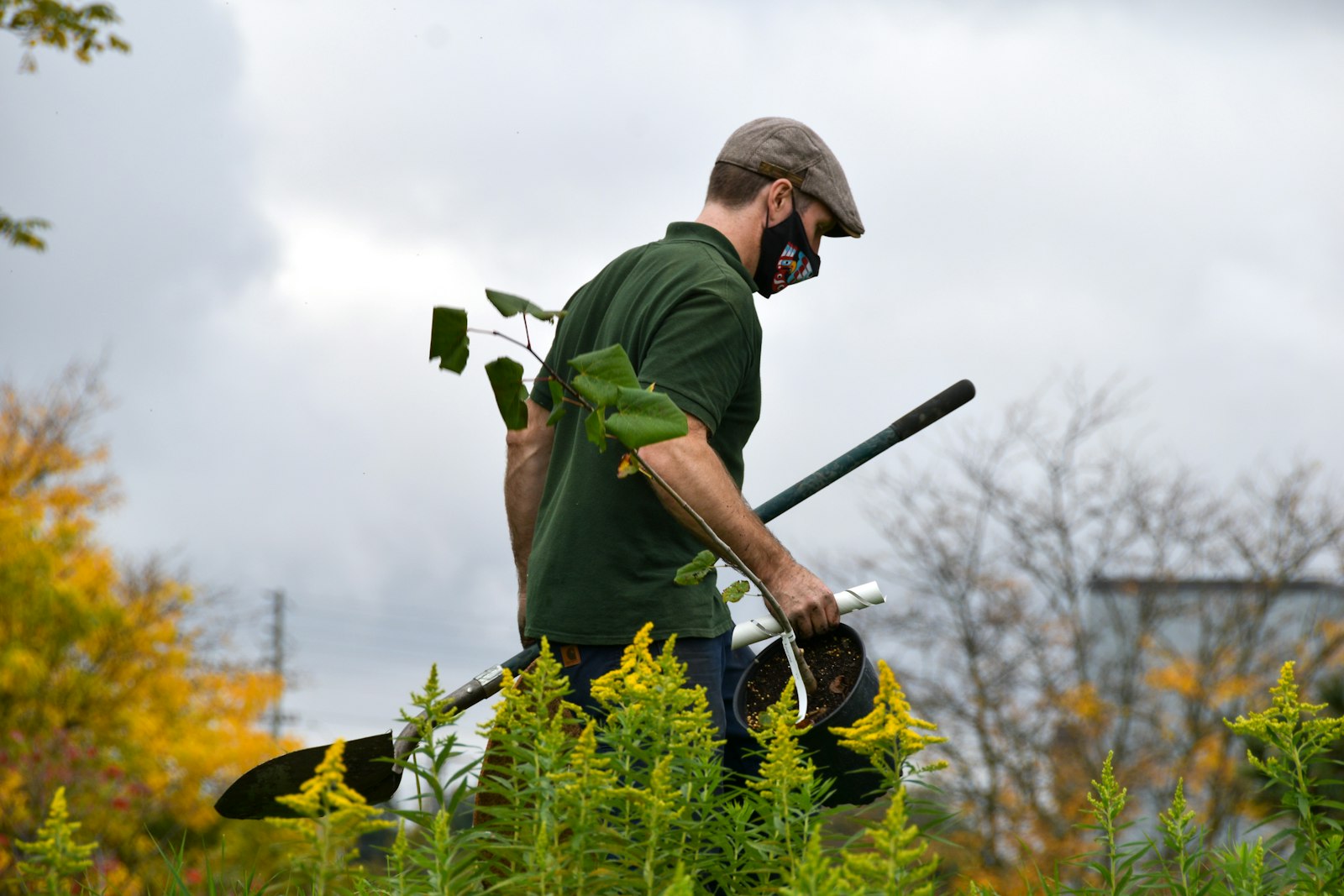 Crew lead holding gardening tools
