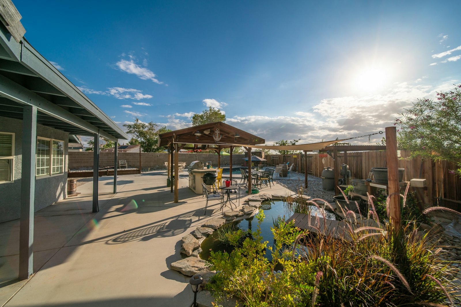 Backyard with a small pond and a gazebo